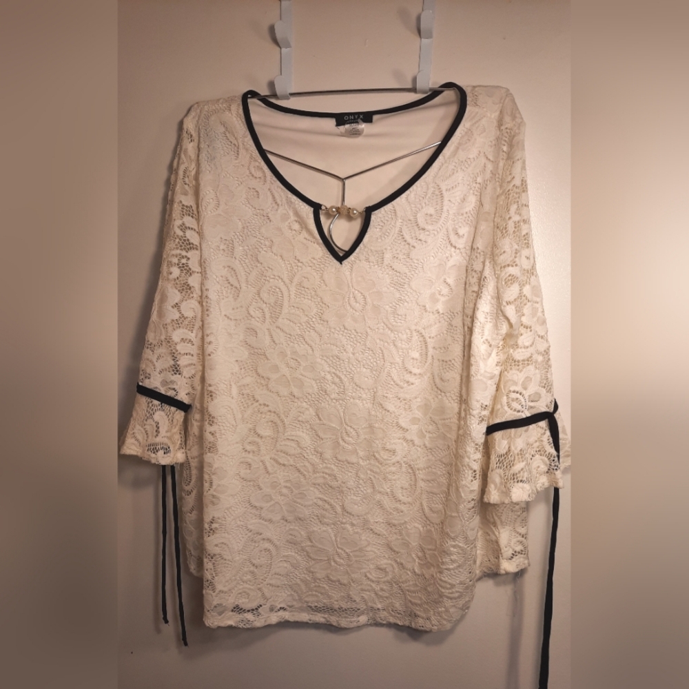 Onyx Apparel White Lace Blouse with Black Trim and Jewel Embellishment.
